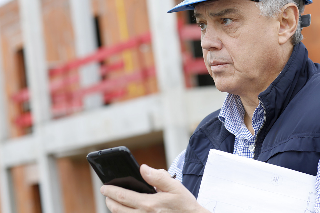 Business owner using a mobile safety app