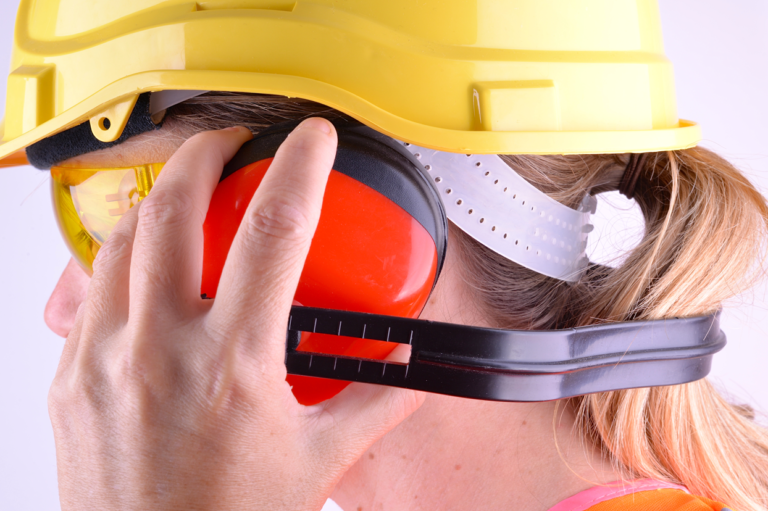 A worker with ear protection. Learn about tips for hiring temporary workers or subcontractors.